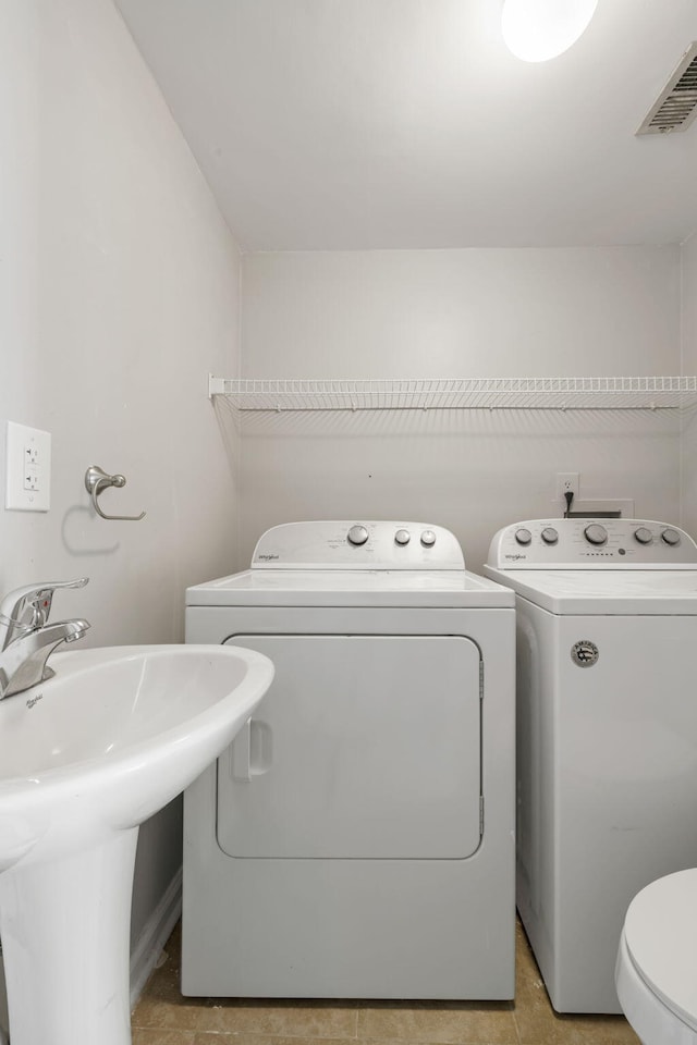 507 Stinson Dr Unit E8, Charleston, SC 29407 - laundry area with washer and clothes dryer