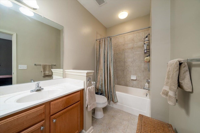 full bathroom with vanity, toilet, tile patterned flooring, and shower / bath combo with shower curtain