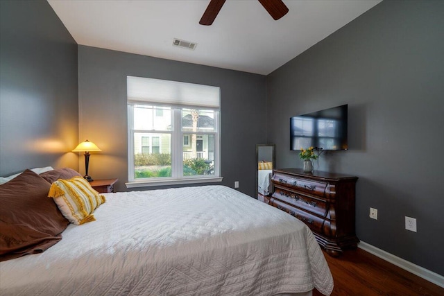 bedroom featuring dark wood-type flooring and ceiling fan