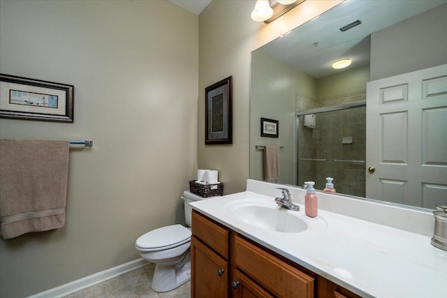 bathroom with a shower with door, vanity, tile patterned flooring, and toilet