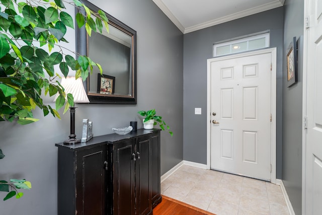 tiled foyer with ornamental molding