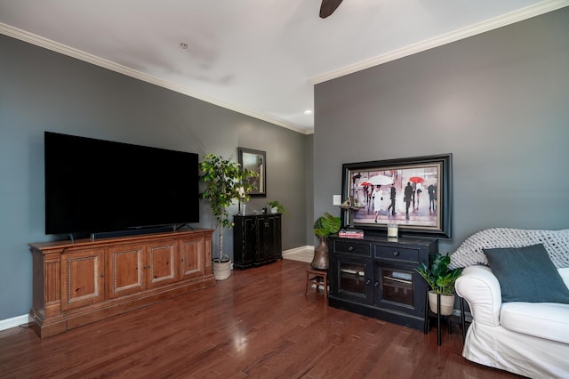 living room with crown molding, ceiling fan, and dark hardwood / wood-style flooring