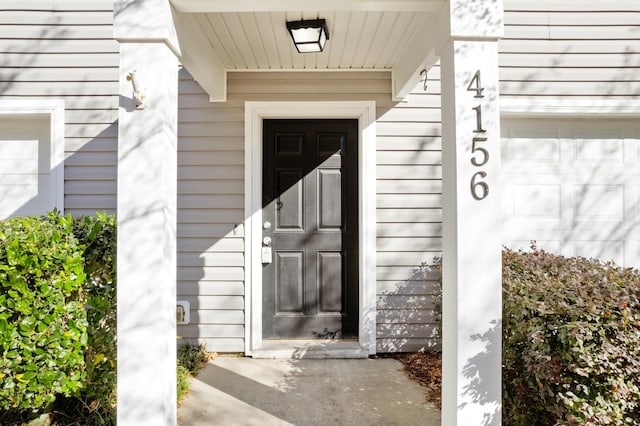 property entrance with a garage