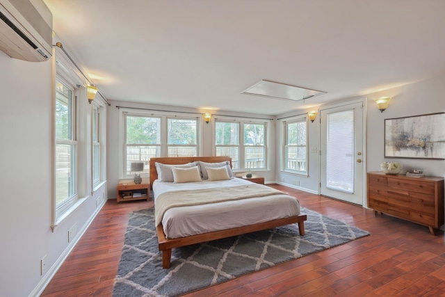 103 Laurens Ct, Summerville, SC 29485 - bedroom featuring multiple windows, attic access, hardwood / wood-style floors, and a wall mounted AC