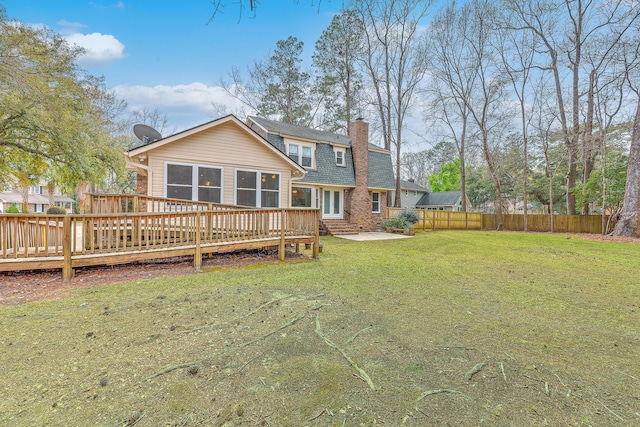 103 Laurens Ct, Summerville, SC 29485 - rear view of house with fence, a wooden deck, a chimney, a lawn, and brick siding