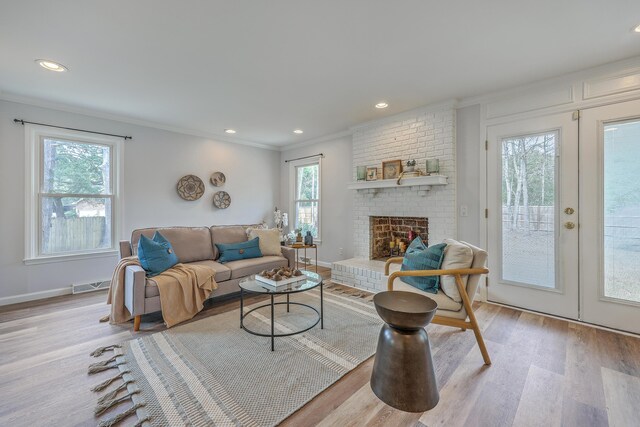 103 Laurens Ct, Summerville, SC 29485 - living area featuring visible vents, a healthy amount of sunlight, crown molding, and light wood finished floors