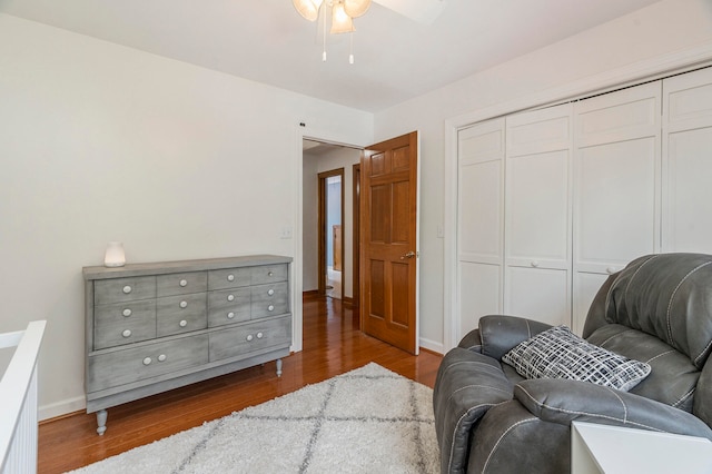 sitting room with hardwood / wood-style floors and ceiling fan