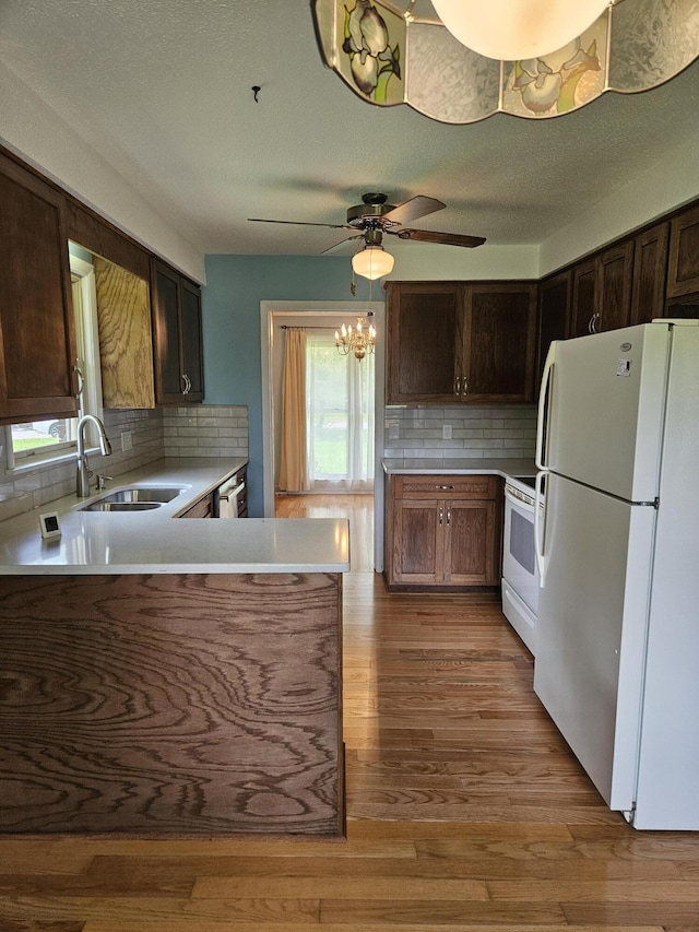101 Brittany Ct, Summerville, SC 29485 - kitchen featuring white appliances, a sink, light countertops, decorative backsplash, and ceiling fan