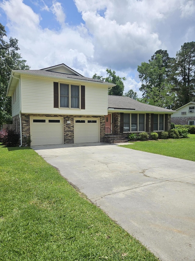 101 Brittany Ct, Summerville, SC 29485 - split level home featuring an attached garage, a front yard, concrete driveway, and brick siding