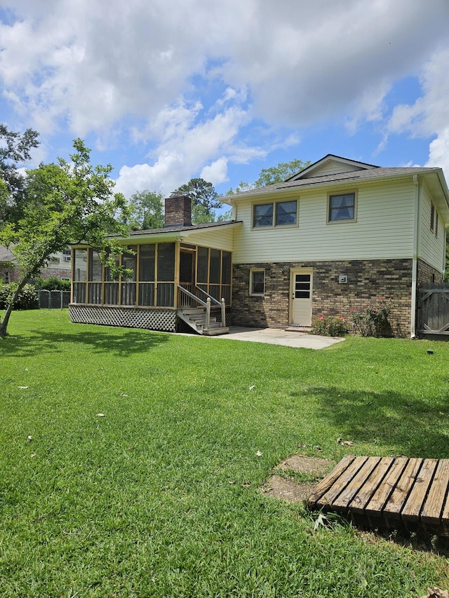 101 Brittany Ct, Summerville, SC 29485 - rear view of property featuring a sunroom, a patio, and a chimney