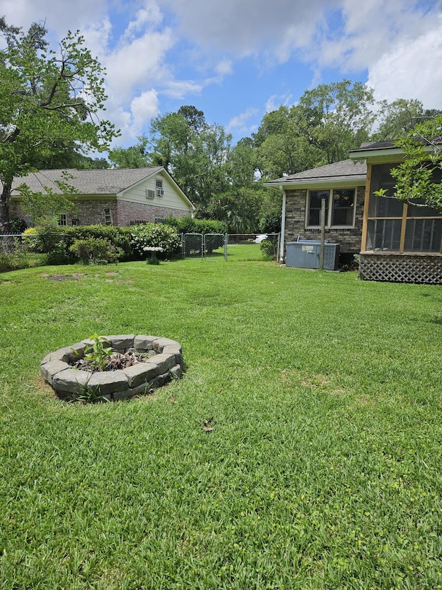 101 Brittany Ct, Summerville, SC 29485 - view of yard with a fire pit and a sunroom