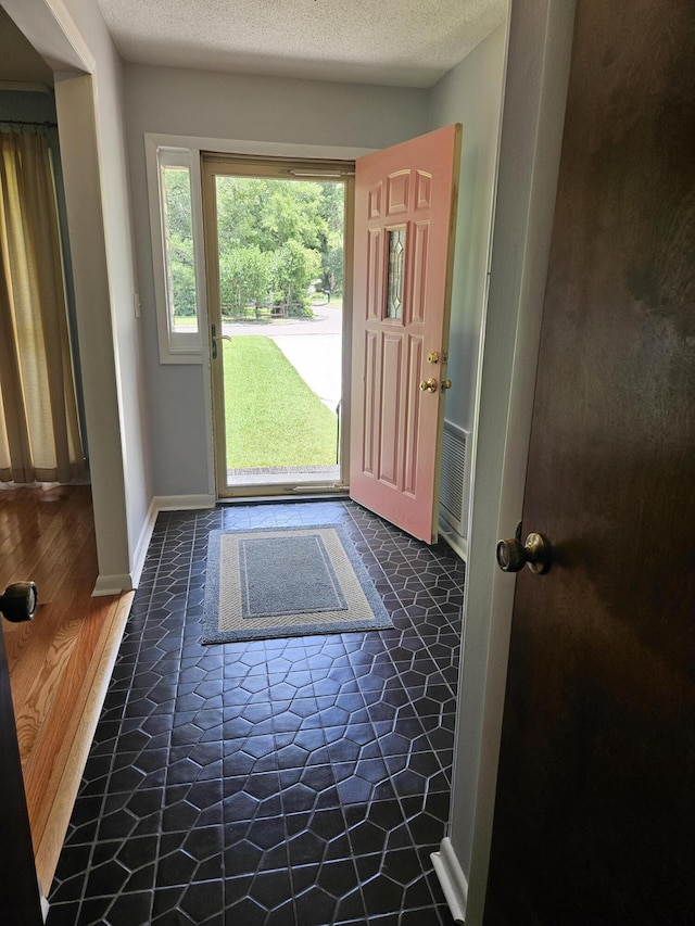 101 Brittany Ct, Summerville, SC 29485 - foyer entrance with a textured ceiling and baseboards