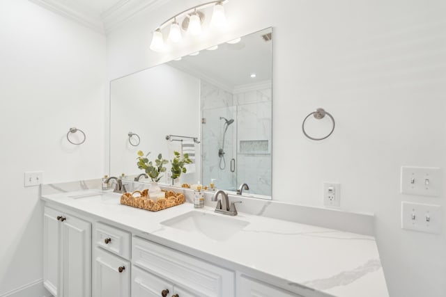 bathroom featuring a shower with shower door, vanity, and crown molding