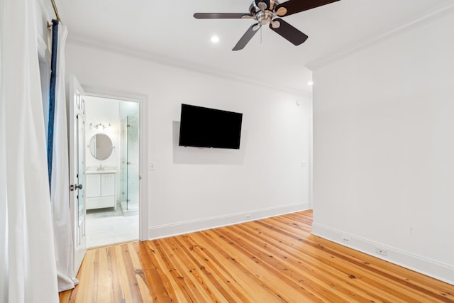 interior space with ceiling fan, crown molding, and hardwood / wood-style flooring