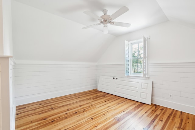 bonus room with ceiling fan, lofted ceiling, and light hardwood / wood-style flooring