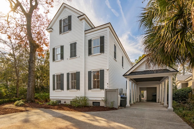 view of front of property featuring a carport