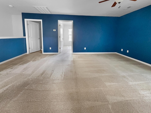 carpeted empty room with ceiling fan