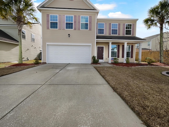 view of front of house featuring a front yard and a garage