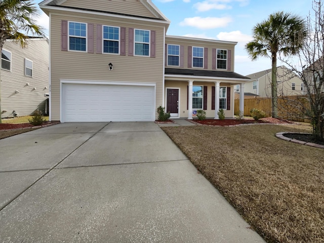 view of front facade featuring a garage and a front yard