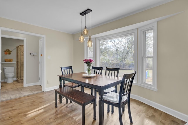 dining area featuring light wood-type flooring