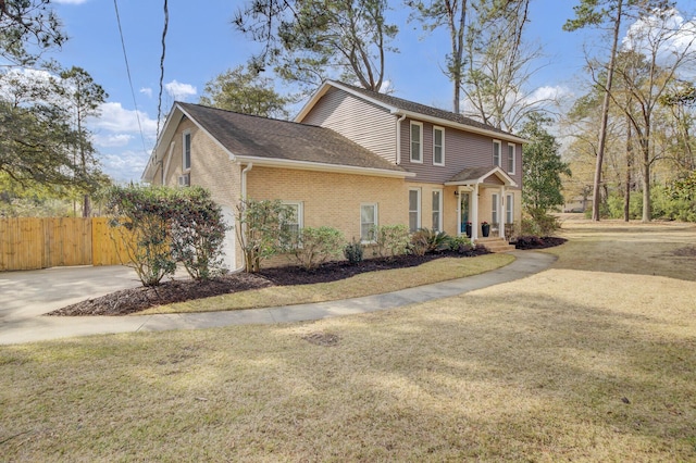 view of side of home featuring a lawn