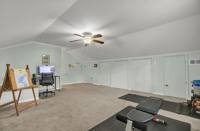 interior space with light carpet, vaulted ceiling, and ceiling fan