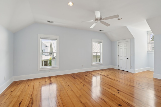 bonus room with light wood-style flooring, visible vents, recessed lighting, lofted ceiling, and baseboards
