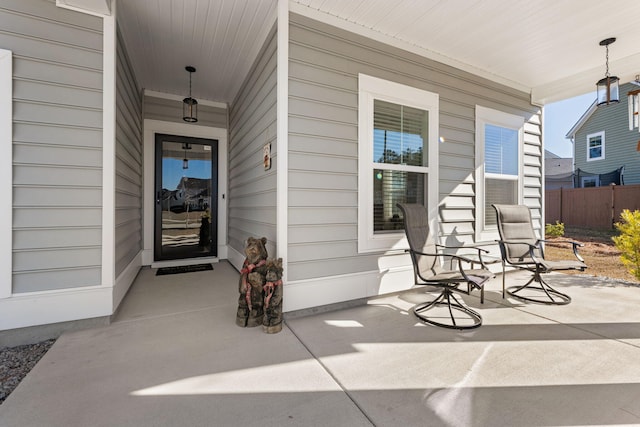 entrance to property featuring a porch