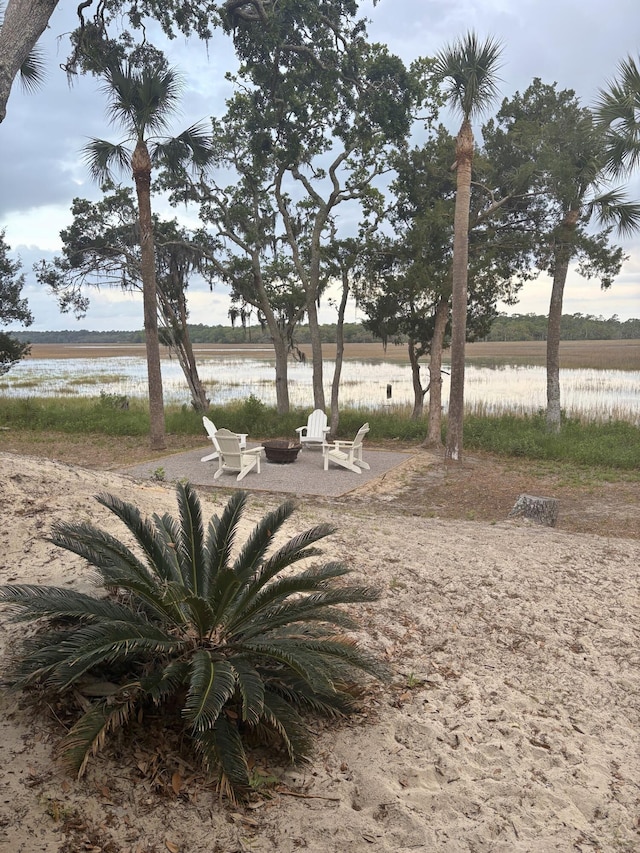 123 Jungle Rd, Edisto Island, SC 29438 - view of yard featuring a fire pit and a water view