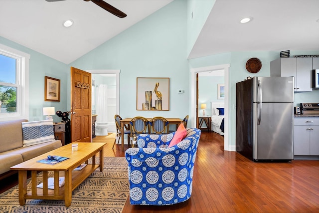 123 Jungle Rd, Edisto Island, SC 29438 - living room with dark wood finished floors, a ceiling fan, high vaulted ceiling, and recessed lighting