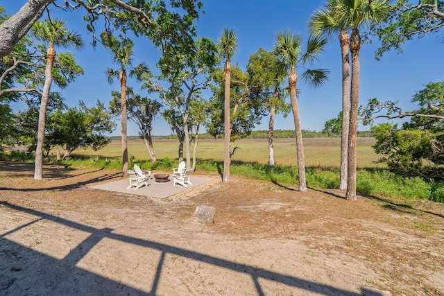 123 Jungle Rd, Edisto Island, SC 29438 - view of yard with an outdoor fire pit and a patio area
