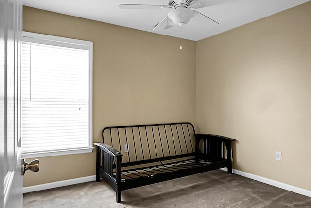 bedroom featuring carpet floors, a ceiling fan, and baseboards