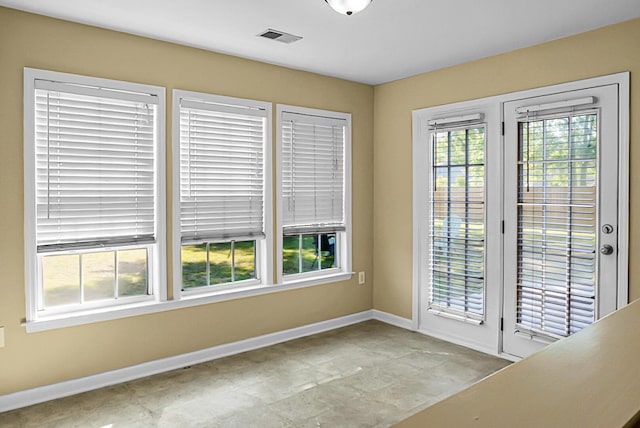 entryway with baseboards and visible vents