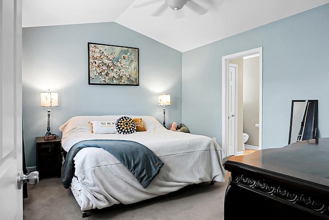 bedroom featuring carpet floors, a ceiling fan, connected bathroom, and lofted ceiling