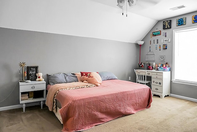 carpeted bedroom with visible vents, baseboards, ceiling fan, and lofted ceiling