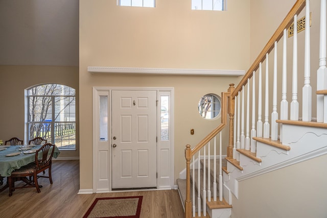 7011 Windmill Creek Rd, Charleston, SC 29414 - foyer entrance featuring wood finished floors, stairway, and a high ceiling