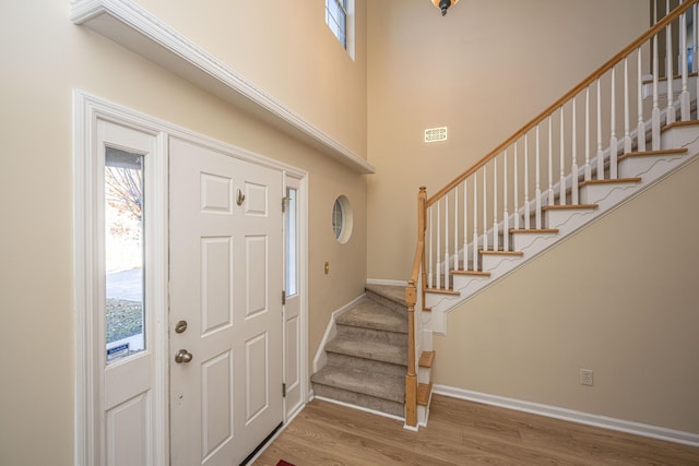 7011 Windmill Creek Rd, Charleston, SC 29414 - foyer entrance with stairs, wood finished floors, and a towering ceiling
