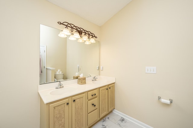 bathroom featuring vanity, toilet, and lofted ceiling