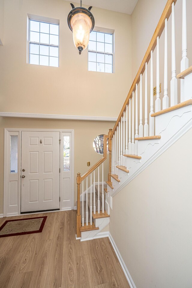 7011 Windmill Creek Rd, Charleston, SC 29414 - entrance foyer with a high ceiling, wood finished floors, and stairway