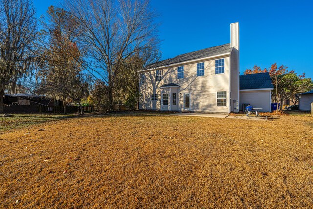 7011 Windmill Creek Rd, Charleston, SC 29414 - rear view of property featuring a patio area and a chimney