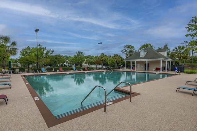 view of swimming pool with a patio area