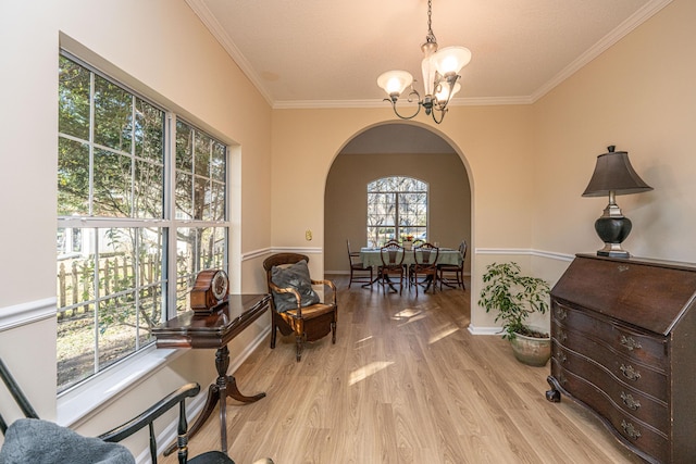 7011 Windmill Creek Rd, Charleston, SC 29414 - living area with arched walkways, a chandelier, ornamental molding, and wood finished floors