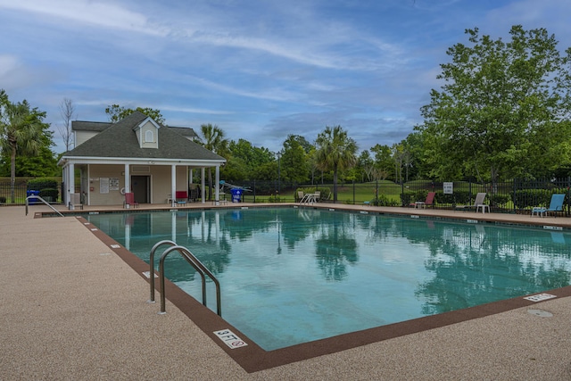 7011 Windmill Creek Rd, Charleston, SC 29414 - community pool with a patio area and view of wooded area
