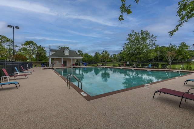 7011 Windmill Creek Rd, Charleston, SC 29414 - community pool featuring a patio area and an outbuilding