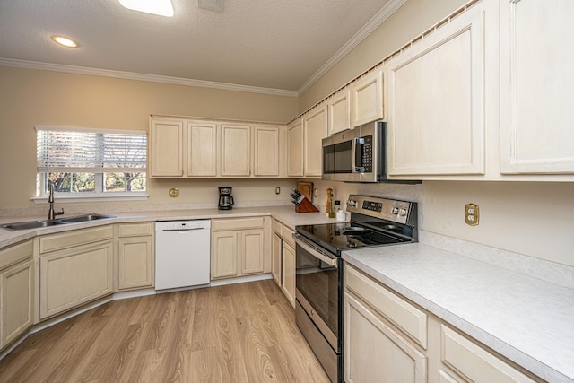 7011 Windmill Creek Rd, Charleston, SC 29414 - kitchen featuring appliances with stainless steel finishes, light wood-style floors, ornamental molding, light countertops, and a textured ceiling