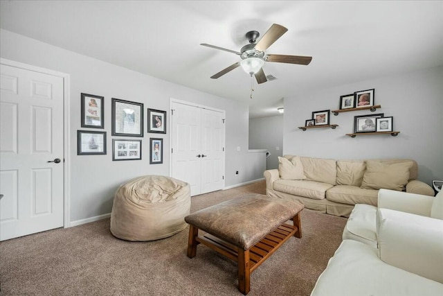 carpeted living room featuring ceiling fan