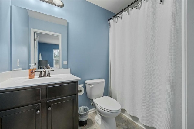 full bathroom with vanity, shower / tub combo with curtain, and toilet