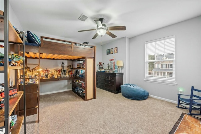 carpeted bedroom featuring ceiling fan