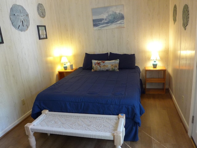 bedroom with wood-type flooring