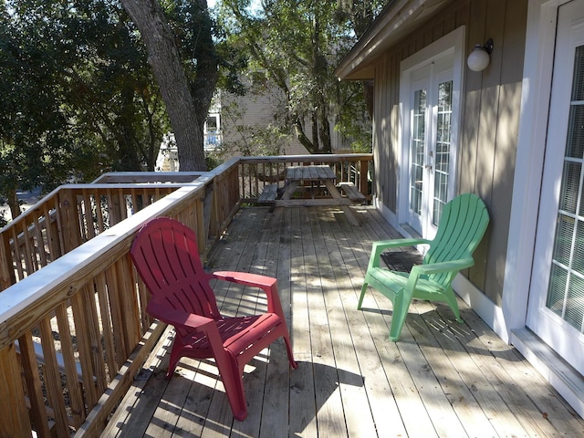 wooden terrace featuring french doors